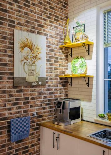 a kitchen with a counter with a microwave on it at Entire Villa Near Tbilisi Nature Reserve with Panoramic View in Mtskheta