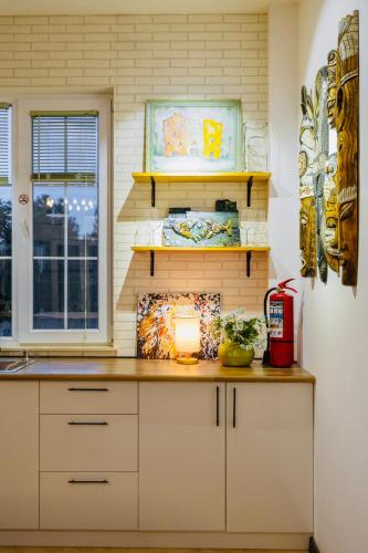 a kitchen with a counter with a light on it at Entire Villa Near Tbilisi Nature Reserve with Panoramic View in Mtskheta