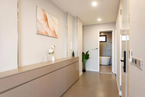 a hallway of a home with a bathroom at Nagomi Apartment in Hanoi