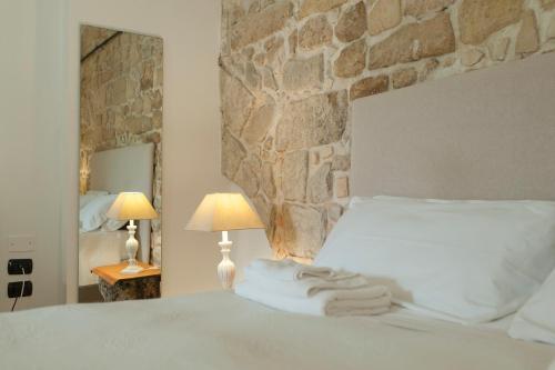 Chiesa Greca Suites - Lecce Selectionにあるベッド
