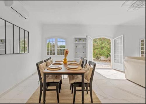 a dining room with a table and chairs at Premium house in Mougins with Private Tennis in Mougins
