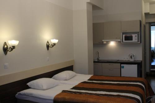 Katil atau katil-katil dalam bilik di Ecoland Hotel