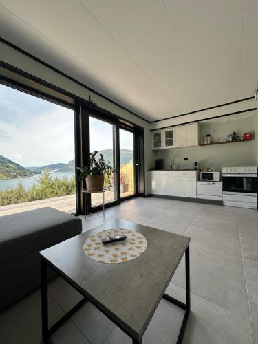 a living room with a couch and a table at Olden Apartment with Panorama view in Olden