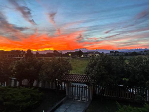 a sunset over a field with a fence at Guest House Sant'Antonio 