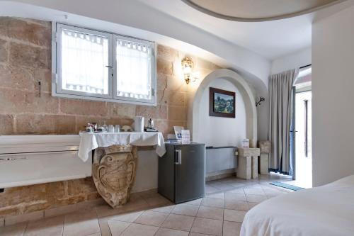 Chiesa Greca Suites - Lecce Selectionにあるベッド