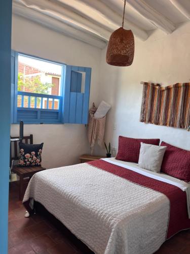 Ένα ή περισσότερα κρεβάτια σε δωμάτιο στο Casa Quintanilla Barichara