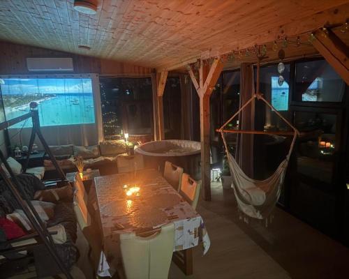 a living room with a table and a couch at Apartament Willa Dom wakacyjny Agroturystyka Zacisze11 Idealny dla rodzin z dziećmi Holiday Home Vacation House", in Węgorzyn