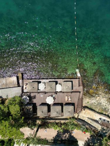 an aerial view of a building by the water at Blue Dreams Resort Bodrum - Aquapark & Ultra All Inclusive in Torba