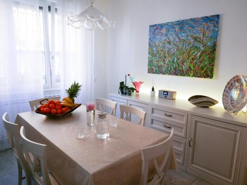 a kitchen with a table with a bowl of fruit on it at Villa Ausilia Legnano in Legnano