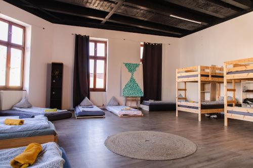 a room with beds and bunk beds in it at Blue Lotus Apartments in Bratislava