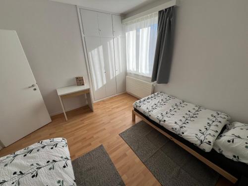 a small bedroom with a bed and a window at Casa Medusa - con piscina, a 2 minuti dalla stazione in Verscio