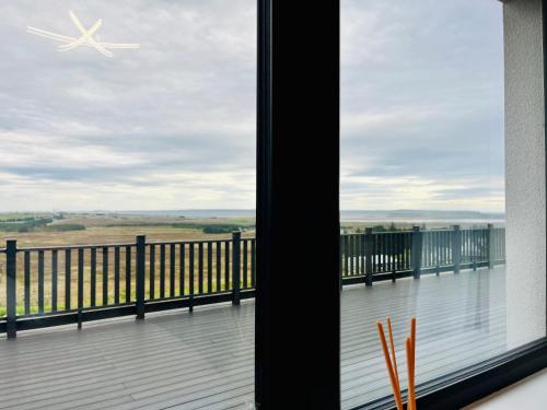 a view from the balcony of a house at Lewis Living in Aird Tong