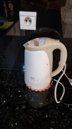 a blender sitting on top of a counter at Bright 2 bedroom apartment, very comfortable in Berkawe