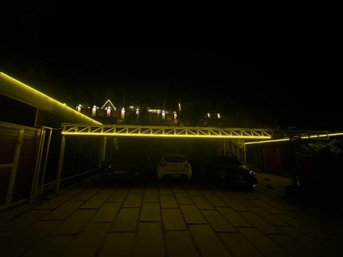 a car parked in a parking lot at night at Kızılcavadibungalows in Kemalpaşa