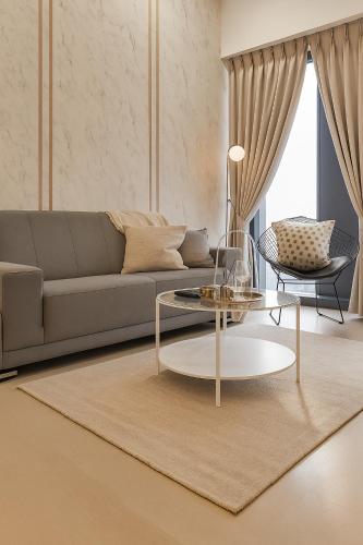 a living room with a couch and a table at Premier Suites Twin Towers at Star Residences in Kuala Lumpur