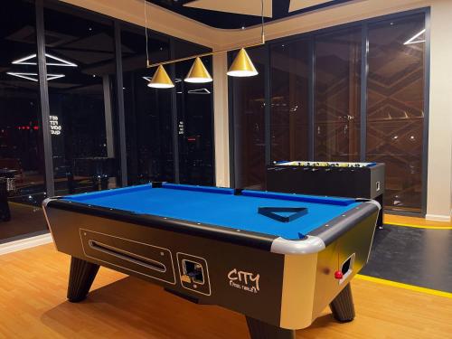 a pool table in the middle of a room at Premier Suites Twin Towers at Star Residences in Kuala Lumpur