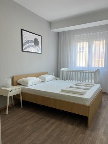 Postel nebo postele na pokoji v ubytování a-apartments