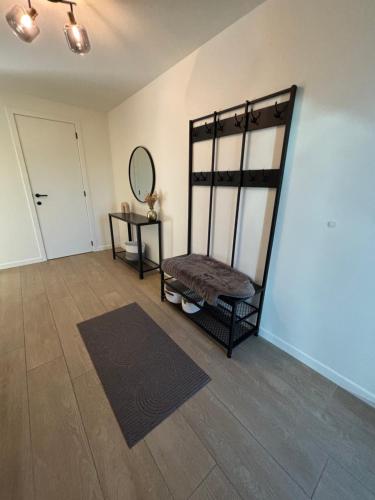 an empty room with a chair and a mirror at Home Terboekt in Genk