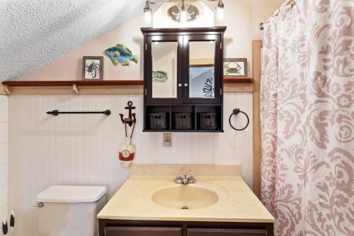 a bathroom with a sink and a toilet at SWC13 - Sea oar Sound in Hatteras