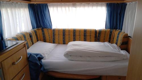 a bed in a room with a window at Yes we camp! Cevedale in Ossana