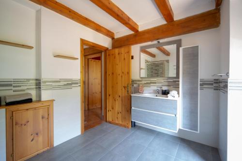 a bathroom with a sink and a shower at 123 la casa nel bosco in Curino