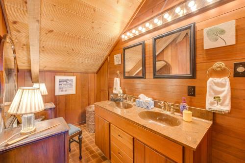 a bathroom with two sinks in a wooden cabin at Pet-Friendly Gem with Private Dock in Deltaville! in Deltaville