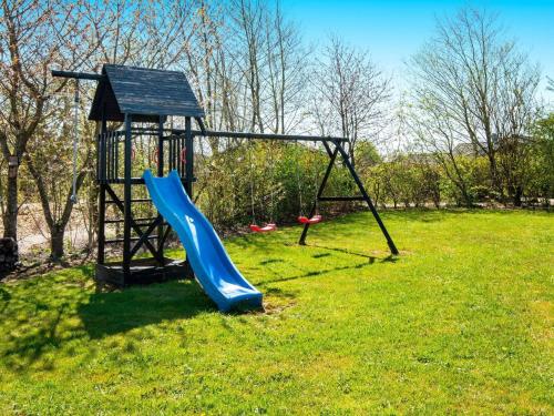 a playground with a slide in a field at Luxury Retreat with Spa - By Traum Ferienwohnungen in Hemmet