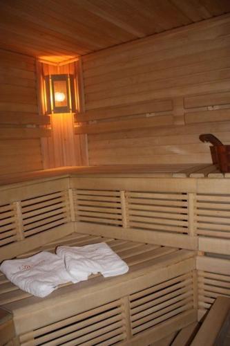 a sauna with two white towels sitting on it at Valentyna in Lviv