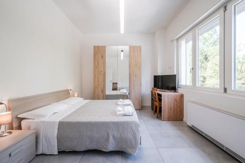 Postel nebo postele na pokoji v ubytování Rivazza Apartment - Free WiFi, Air Conditioning & Private Parking