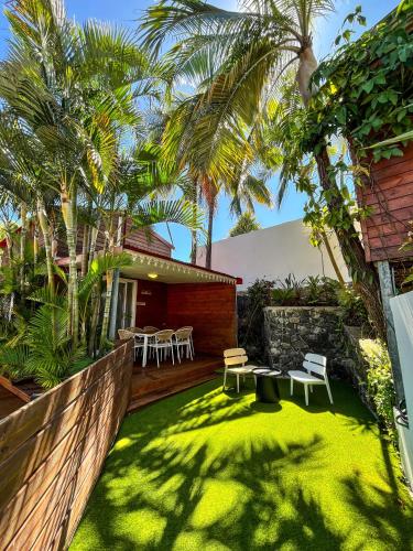 Aed väljaspool majutusasutust Bungalow avec Piscine privée