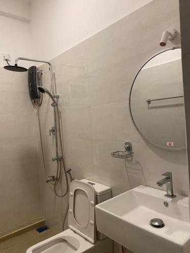 a bathroom with a shower and a toilet and a sink at Unawatuna House in Unawatuna