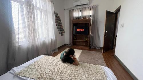 a child laying on a bed in a bedroom at Lotus of Creation in Pushkar