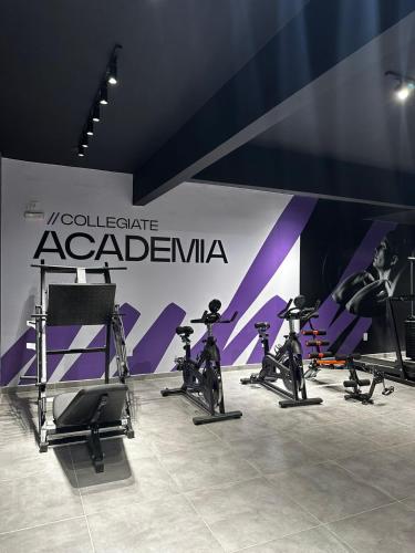 a group of exercise bikes parked next to a wall at Studio BQ 3 in Barbacena