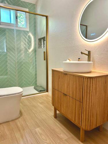 a bathroom with a sink and a shower at Fuente Ghadira Aracena in Aracena