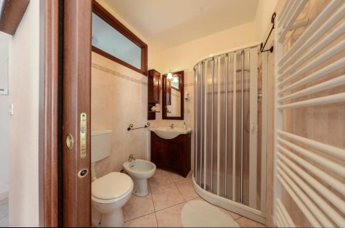 a bathroom with a toilet and a sink at Casa Scola Loano in Loano