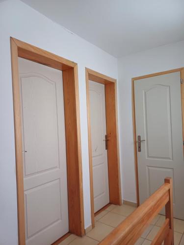 a room with two doors and a staircase in it at Zlatiborska noć in Zlatibor