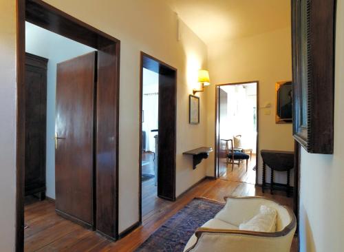 a living room with a couch and a mirror at Villa Virginia Calalzo di Cadore in Calalzo