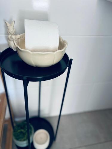 a black table with a bowl on top of it at Luna Holiday Home in Maun