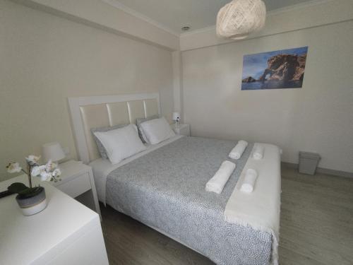 a bedroom with a bed with two white pillows at Brisa Do Mar - Consolação in Peniche