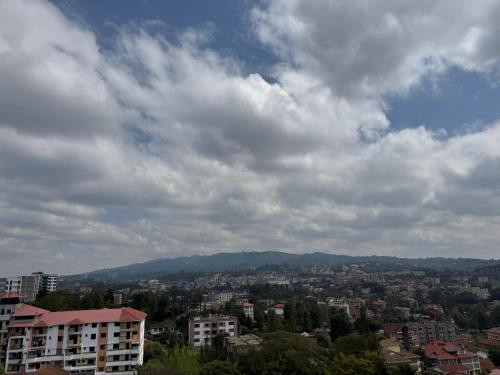 a view of a city under a cloudy sky at Anny's bnb in Ngong