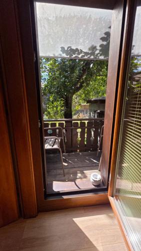 a sliding glass door with a view of a patio at Lonys Wanderlust Nahe Zermatt in Sankt Niklaus