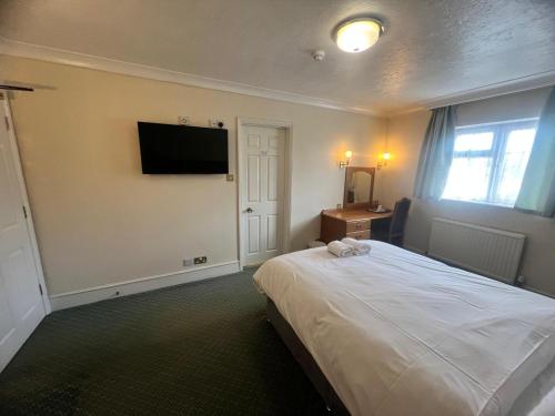 Rivenhall Garden Hotelにあるベッド