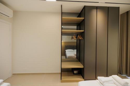 a bedroom with a closet with a bed in it at Kevin & Endri Luxury Apartment Kalaja Vlore in Vlorë