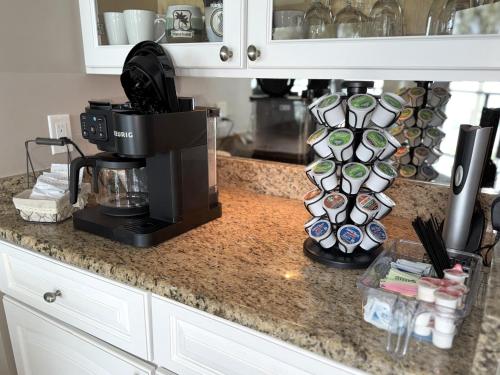 a coffee maker on a counter in a kitchen at Heated 2 Bath Waterfront Upscale Condo in Marco Island