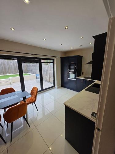a kitchen with a table and chairs and a counter top at The City Haven Near City Centre in York