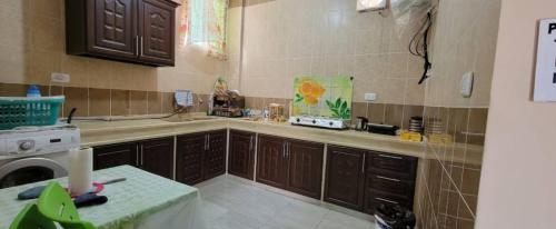 a kitchen with a sink and a counter top at Idris home in Wadi Musa