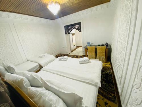Voodi või voodid majutusasutuse Parvina Hotel in old city toas