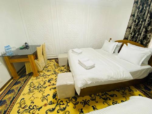 Voodi või voodid majutusasutuse Parvina Hotel in old city toas