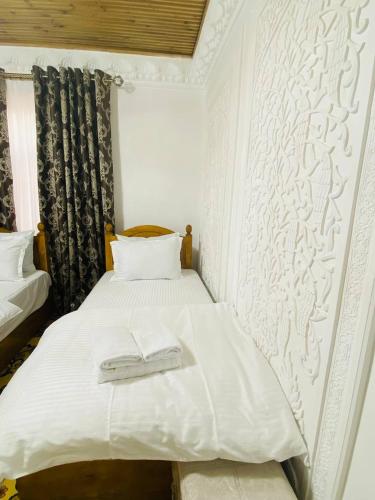 Voodi või voodid majutusasutuse Parvina Hotel in old city toas