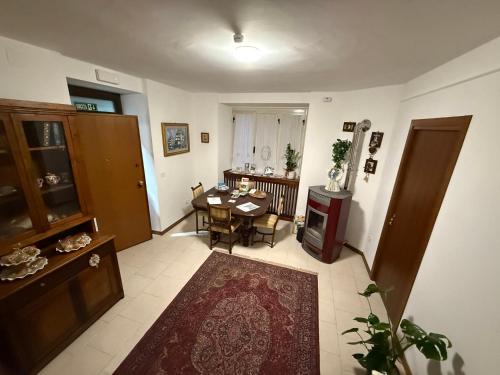 a living room with a table and a stove at Frami b&b in Teramo